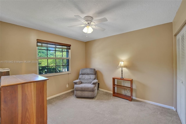 living area with carpet and baseboards