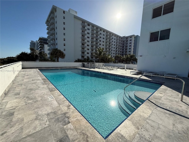 pool featuring a patio area