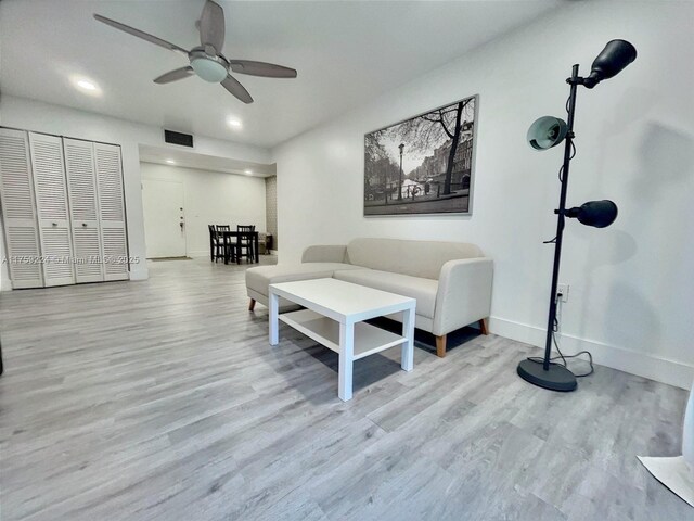 7100 NW 17th St Unit 111, Plantation, FL 33313 - living area with a ceiling fan, baseboards, wood finished floors, and recessed lighting