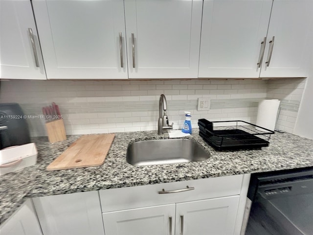 7100 NW 17th St Unit 111, Plantation, FL 33313 - kitchen featuring tasteful backsplash, a sink, white cabinetry, dishwasher, and light stone counters