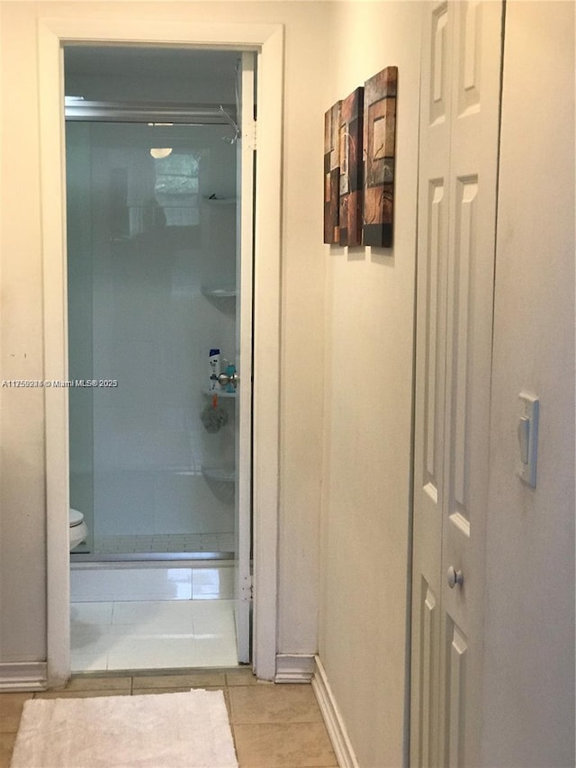 7100 NW 17th St Unit 111, Plantation, FL 33313 - bathroom with tile patterned flooring, baseboards, and toilet