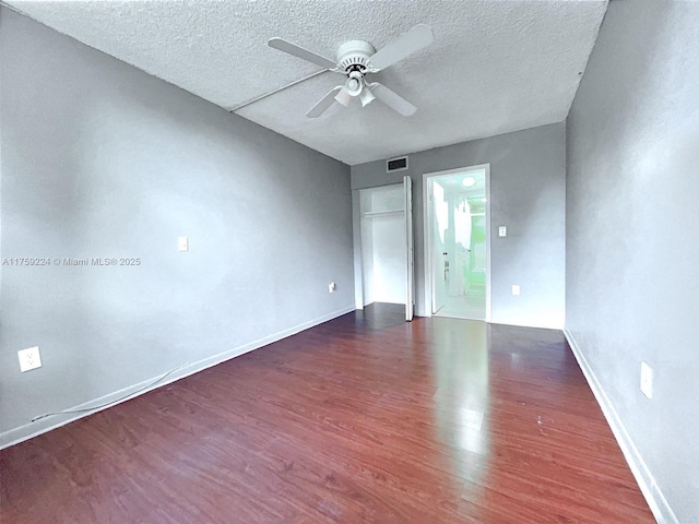 7100 NW 17th St Unit 111, Plantation, FL 33313 - empty room with wood finished floors, a ceiling fan, a textured ceiling, and baseboards