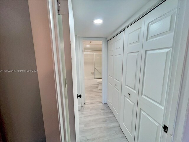 7100 NW 17th St Unit 111, Plantation, FL 33313 - hallway featuring light wood-style flooring and recessed lighting
