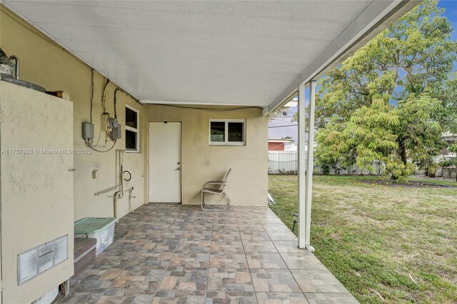 view of patio with fence and visible vents