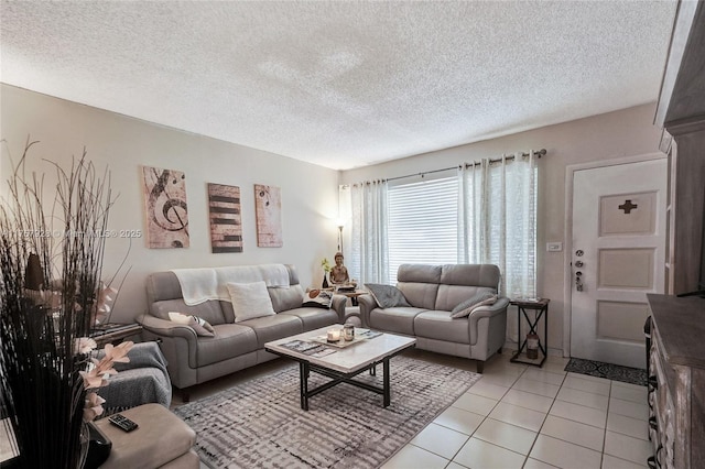 living room featuring light tile patterned floors and a textured ceiling