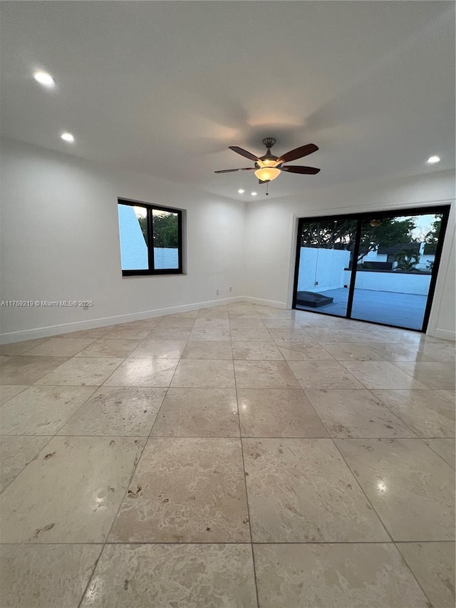 spare room featuring baseboards, a ceiling fan, and recessed lighting