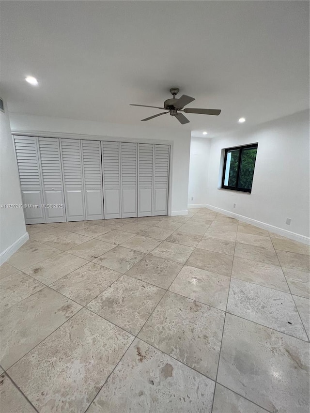 unfurnished bedroom with baseboards and recessed lighting