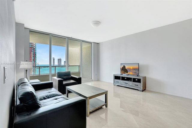 3340 NE 190th St Unit 1608, Aventura, FL 33180 - living room featuring light tile patterned flooring and baseboards