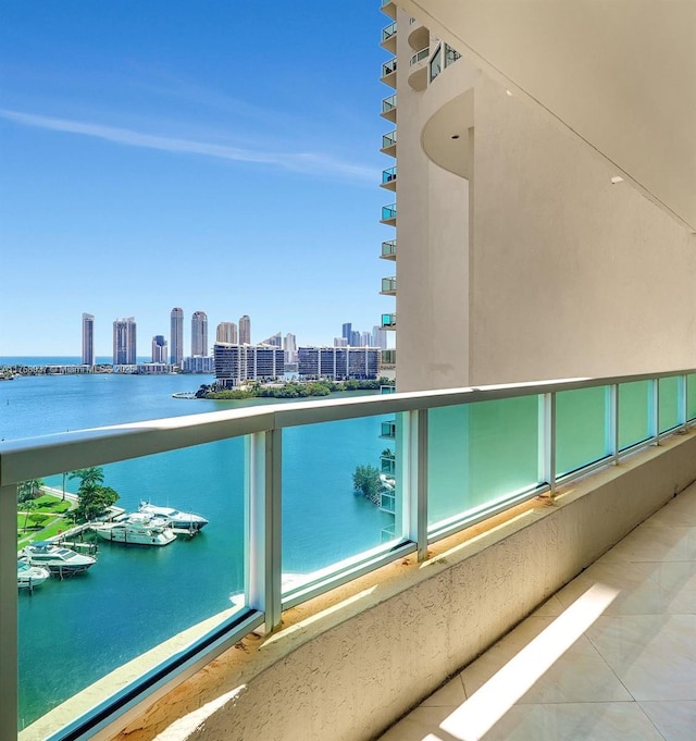 balcony with a view of city and a water view