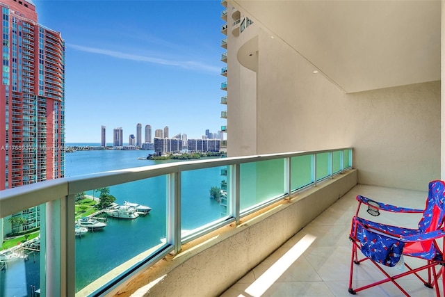 balcony with a view of city and a water view