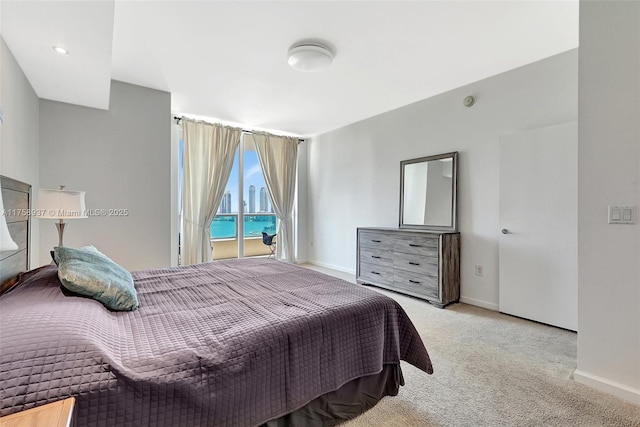 3340 NE 190th St Unit 1608, Aventura, FL 33180 - bedroom with carpet flooring, baseboards, and access to outside