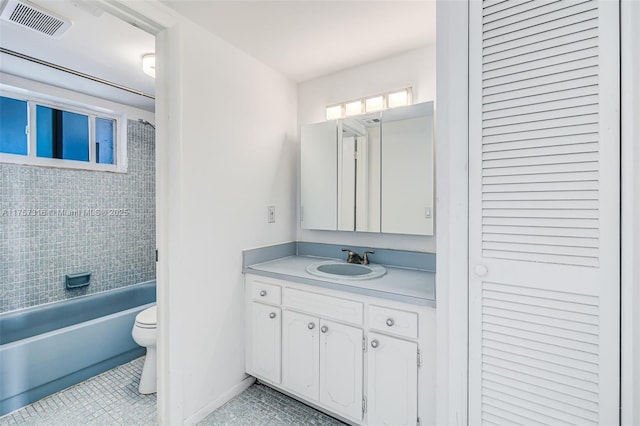 bathroom featuring visible vents, toilet, vanity,  shower combination, and tile patterned flooring