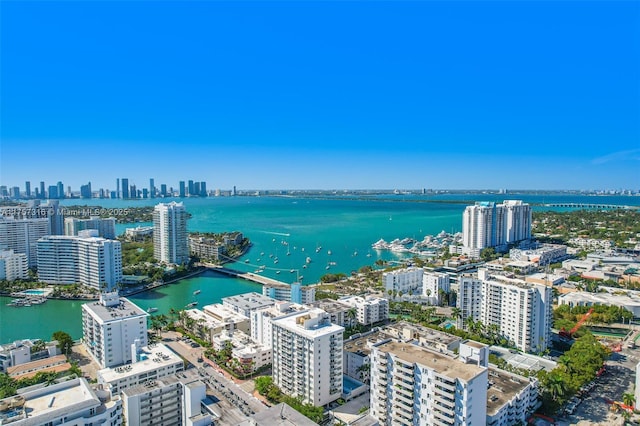 bird's eye view featuring a view of city and a water view