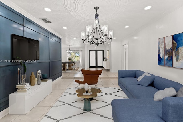 living room with light tile patterned floors, visible vents, crown molding, and an inviting chandelier