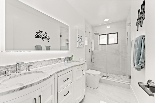 full bath with double vanity, a stall shower, a sink, and toilet