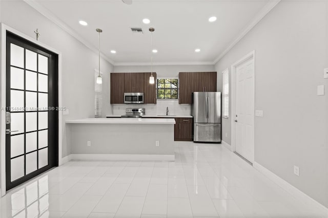 kitchen featuring a sink, visible vents, baseboards, light countertops, and appliances with stainless steel finishes