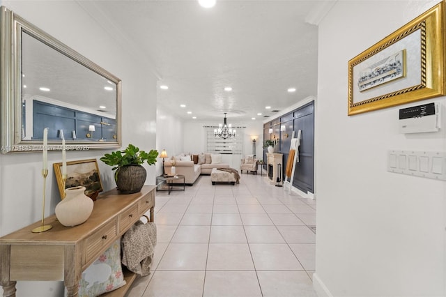 living room featuring crown molding, recessed lighting, a notable chandelier, and light tile patterned floors