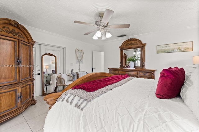 bedroom with crown molding, visible vents, a textured ceiling, and light tile patterned flooring