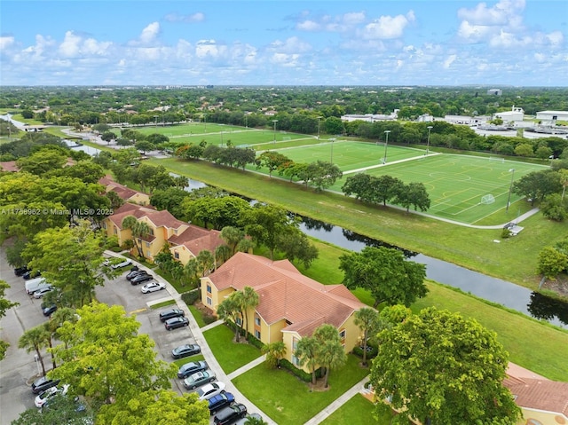 birds eye view of property with a water view