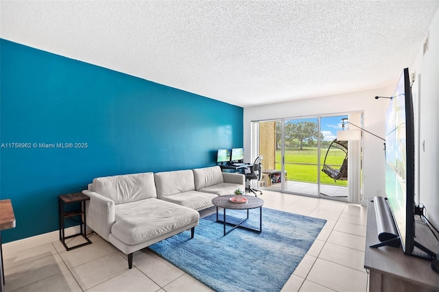 tiled living room with baseboards and a textured ceiling