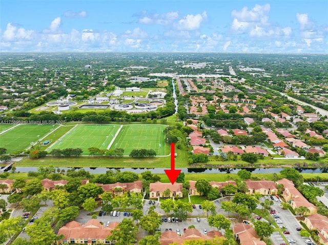 bird's eye view featuring a water view and a residential view