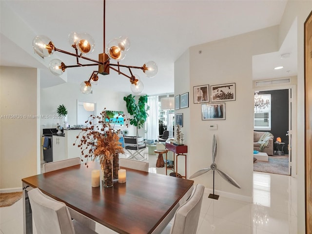 dining room with plenty of natural light, light tile patterned flooring, and baseboards