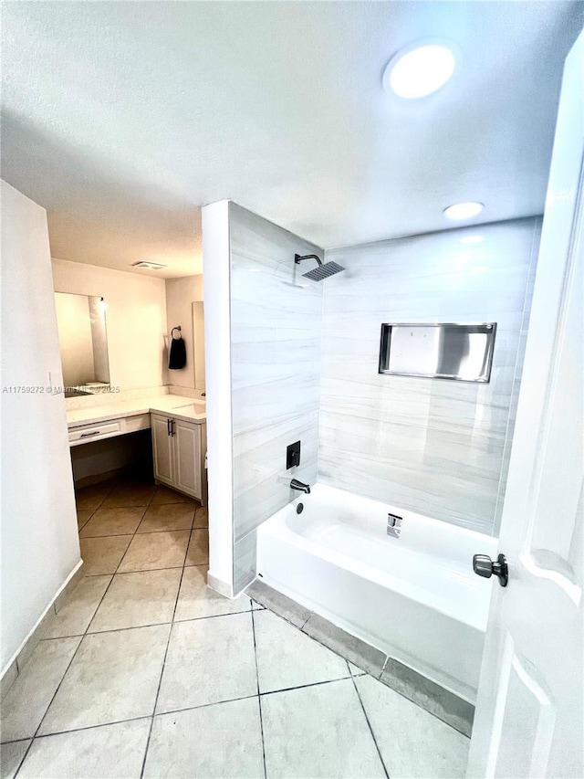 full bathroom featuring bathtub / shower combination, tile patterned flooring, and vanity