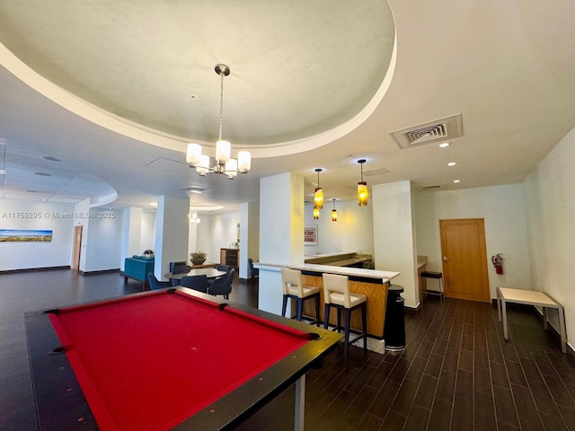 game room featuring dark wood finished floors, a raised ceiling, billiards, and visible vents