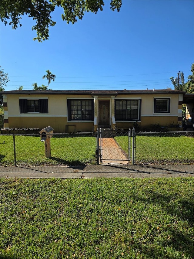 ranch-style house featuring a fenced front yard, a gate, a front lawn, and stucco siding