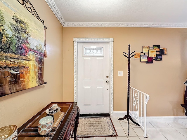 entrance foyer featuring light tile patterned floors, baseboards, and ornamental molding