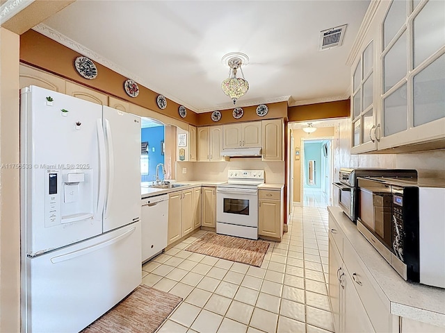 kitchen featuring light countertops, visible vents, a sink, white appliances, and under cabinet range hood