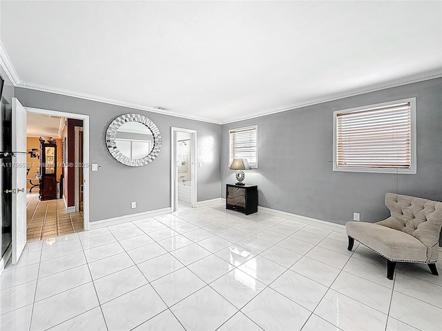 living area with light tile patterned flooring, crown molding, and baseboards