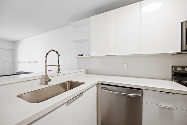 kitchen with dishwasher, white cabinetry, open shelves, a sink, and range with electric stovetop