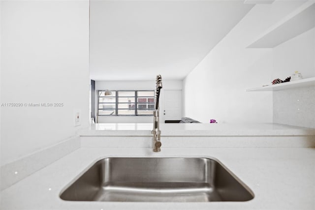 details with light countertops and a sink