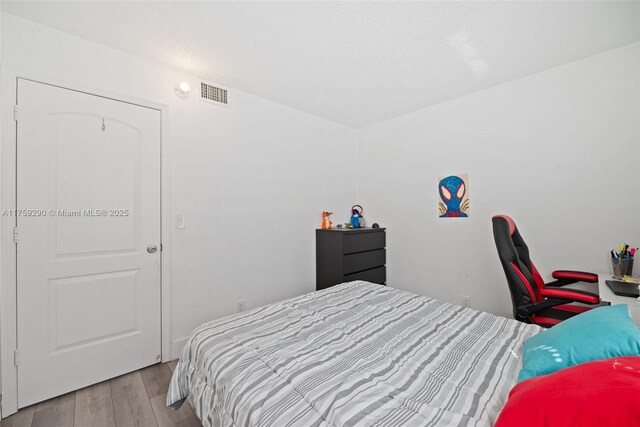 835 Twin Lakes Dr Unit 30-C, Coral Springs, FL 33071 - bedroom with wood finished floors