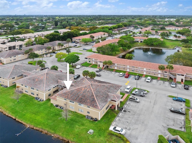 bird's eye view featuring a residential view and a water view