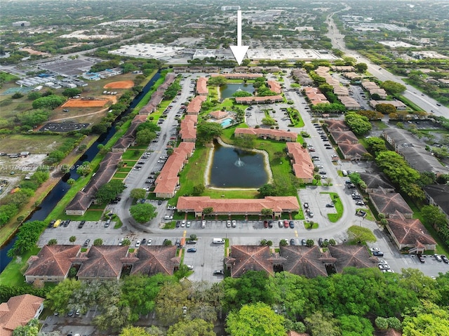 drone / aerial view with a water view