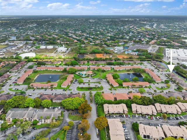 birds eye view of property featuring a water view and a residential view