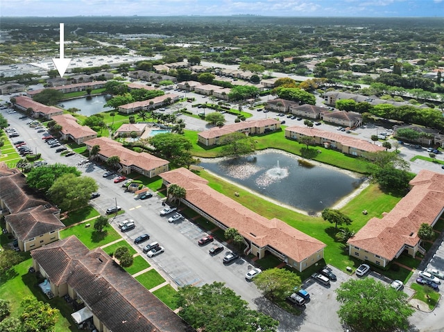 aerial view featuring a water view and a residential view