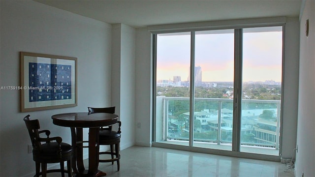 2889 Mcfarlane Rd Unit 1511, Miami, FL 33133 - dining room with a view of city and floor to ceiling windows