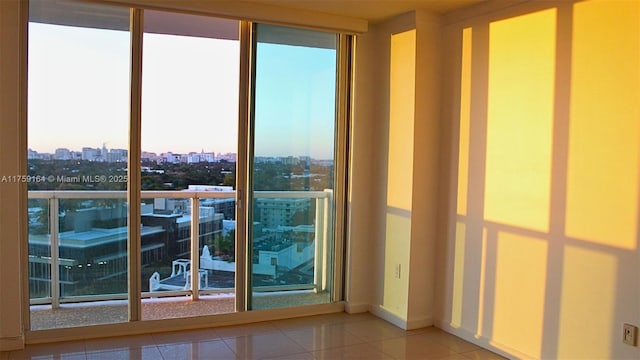 2889 Mcfarlane Rd Unit 1511, Miami, FL 33133 - doorway featuring a view of city, baseboards, and tile patterned floors