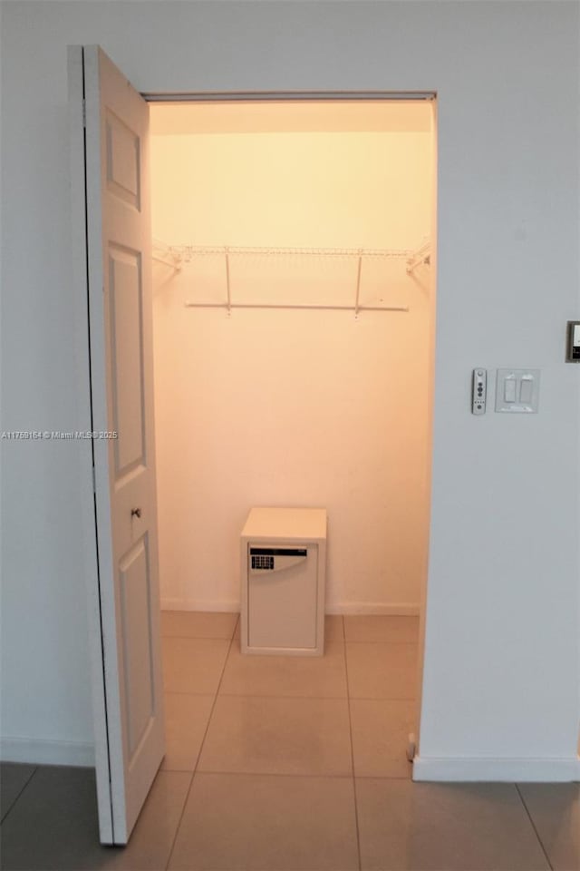2889 Mcfarlane Rd Unit 1511, Miami, FL 33133 - walk in closet featuring light tile patterned floors