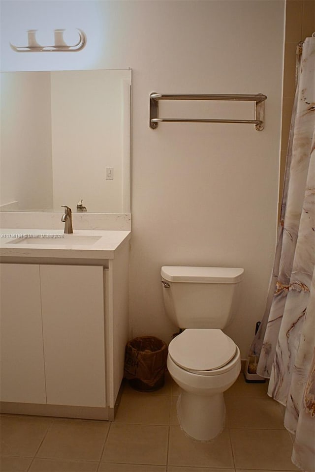 2889 Mcfarlane Rd Unit 1511, Miami, FL 33133 - bathroom with a shower with curtain, vanity, toilet, and tile patterned floors