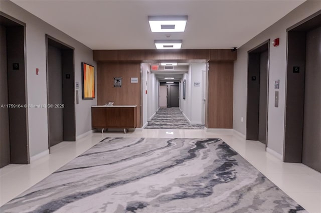2889 Mcfarlane Rd Unit 1511, Miami, FL 33133 - corridor with tile patterned floors and elevator