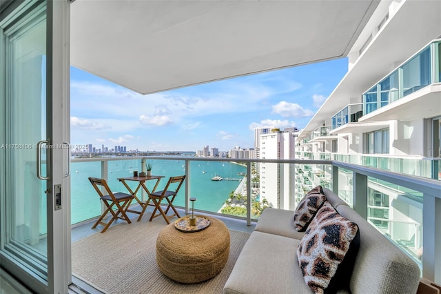 balcony with a view of city and a water view