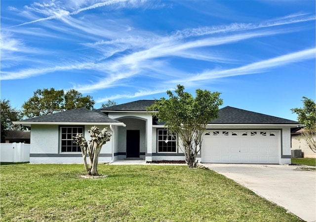 ranch-style house with a garage, driveway, central AC unit, a front lawn, and stucco siding