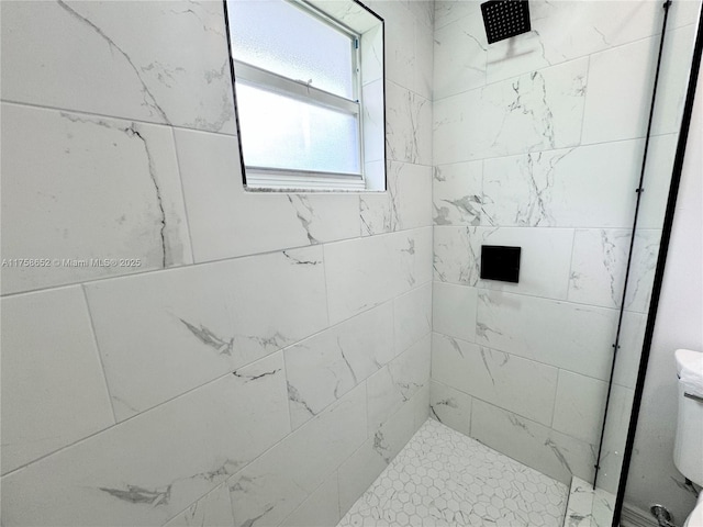 full bath with tiled shower