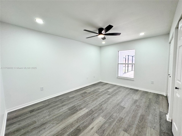 unfurnished bedroom featuring recessed lighting, dark wood finished floors, and baseboards