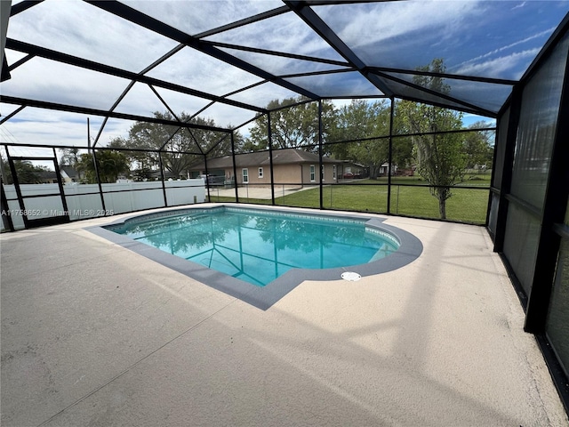 view of pool featuring a patio area, glass enclosure, a fenced in pool, and a yard