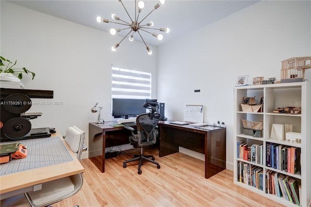 office space with lofted ceiling, an inviting chandelier, and wood finished floors